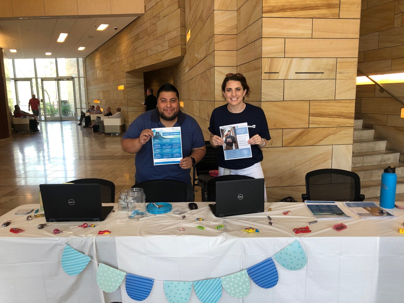 At a learning fair, sharing learning paths and course resources with employees.